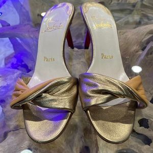 Vintage, Unworn Christian Louboutins two tone gold leather sandals.